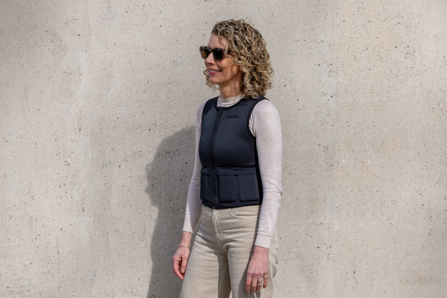Adjustable 5kg weighted vest for women worn with casual clothing. Premium women's specific weighted vest with body contouring fit for comfort