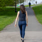 Adjustable 5kg weighted vest for women. Premium women's specific weighted vest with body contouring fit for comfort. woman walking in weighted vest